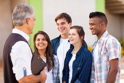 5 people standing in a group